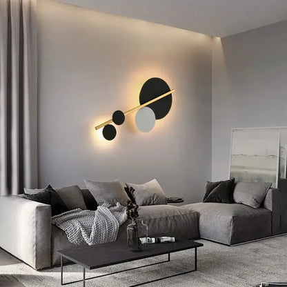 Modern gold led wall lamp with black white and gold circular fixtures on a sleek golden bar for bedroom decorbites led wall