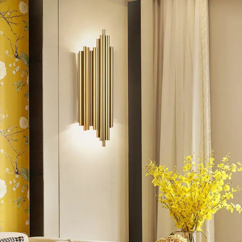 Modern gold led wall lamp with brass rods and staggered cylindrical tubes for living room decorbites gold led sconce
