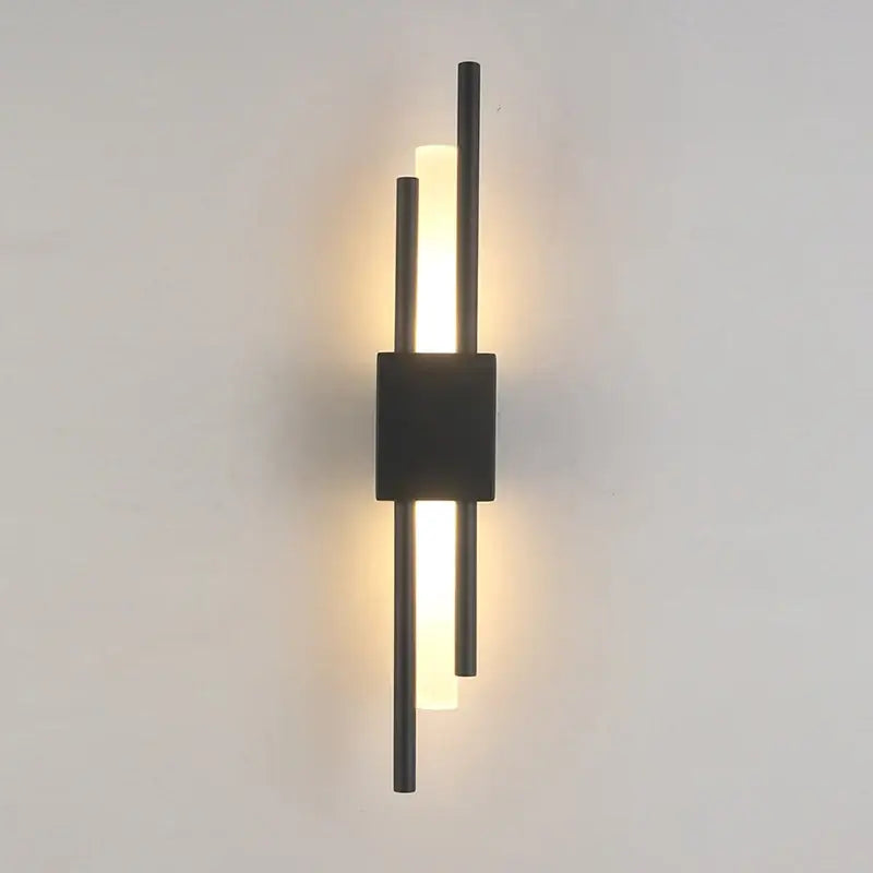 Modern gold led wall sconce with sleek black vertical rods and warm ambient lighting for bedroom decorbites led wall sconce