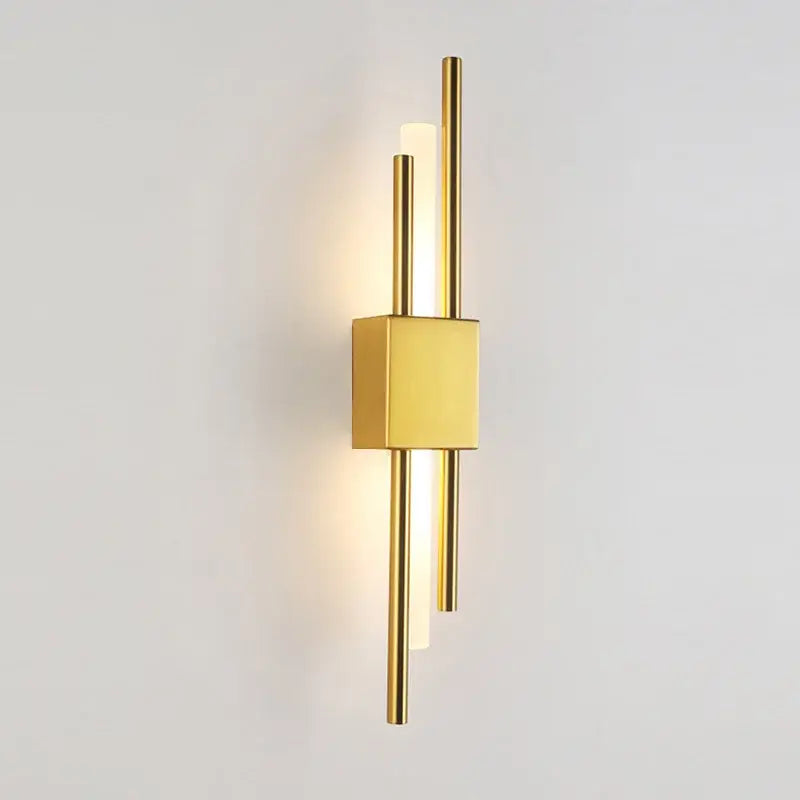 Modern gold led wall sconce with sleek vertical rods and square base for bedroom ambient lighting decorbites led wall sconce