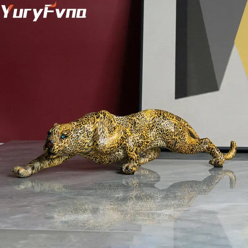 Modern gold leopard resin statue with intricate spotted pattern and blue eyes for living room decorbites leopard resin decor