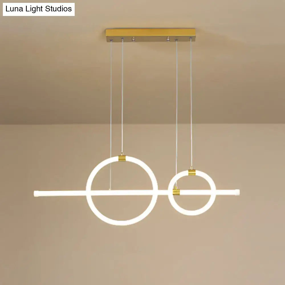 Modern minimalist DecorBites gold linear ring LED pendant light with glowing circles for dining room with acrylic design