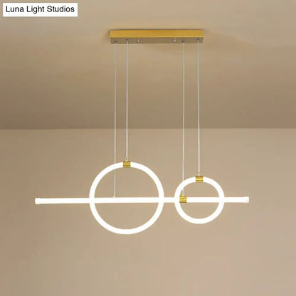 Modern minimalist DecorBites gold linear ring LED pendant light with glowing circles for dining room with acrylic design