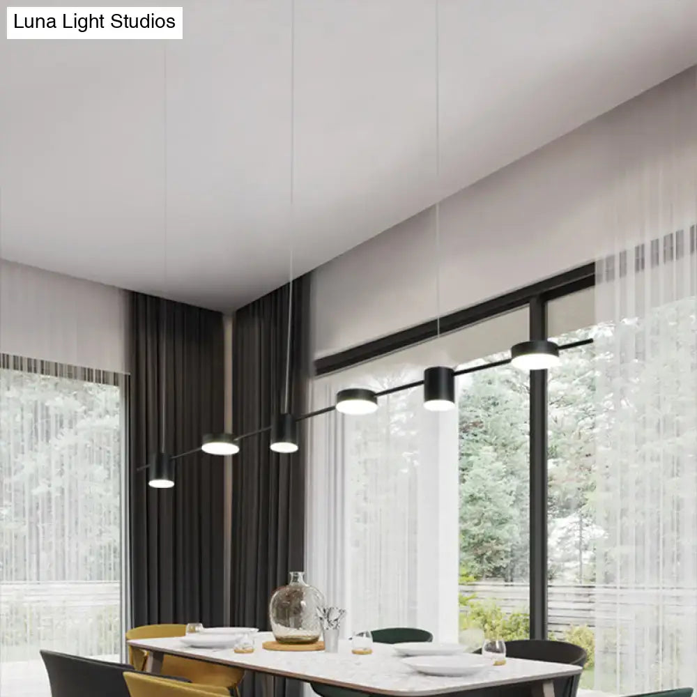 Modern black led pendant light with sleek cylindrical shades and minimalist design for dining room use