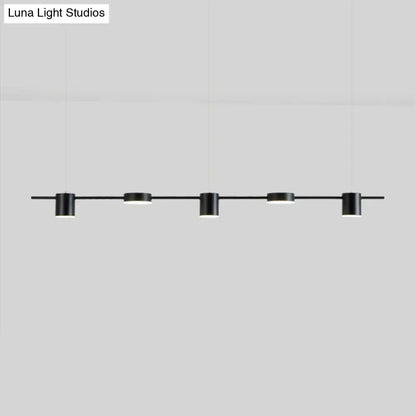 Modern gold linear shaped led pendant light with five black cylindrical fixtures for dining room illumination