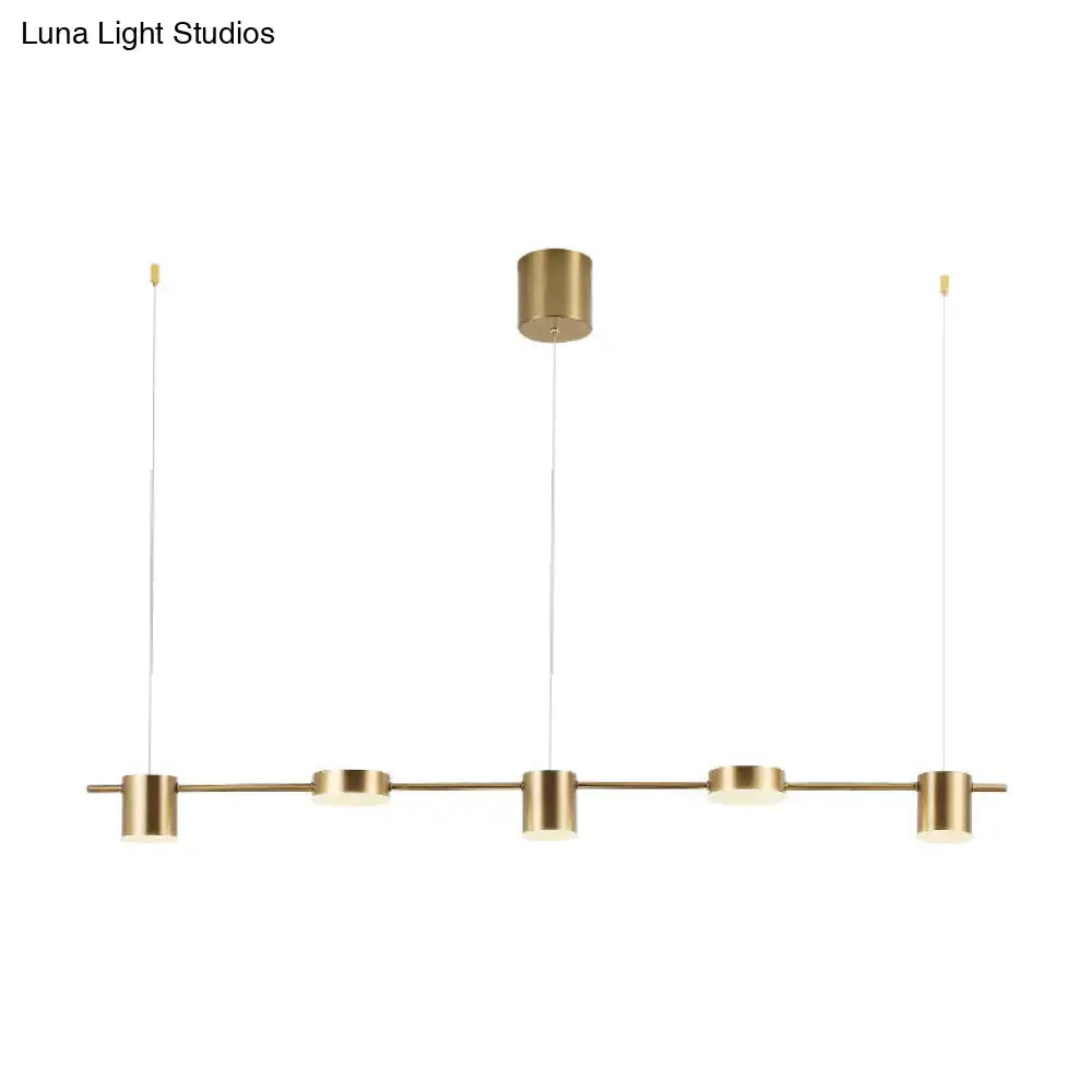 Modern gold linear shaped led pendant light with brass finish and four cylindrical bulbs for dining room use