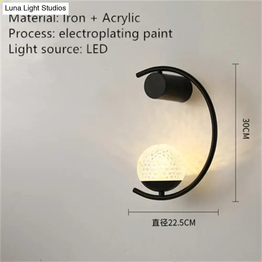 Black iron and acrylic luxury creative led bedside wall sconce with curved arm and illuminated textured globe