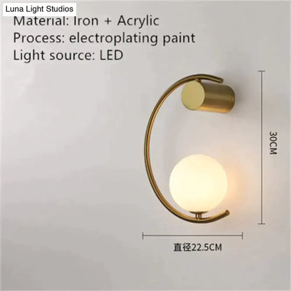 Modern gold luxury creative led bedside wall lamp with curved iron frame and frosted acrylic globe sconce