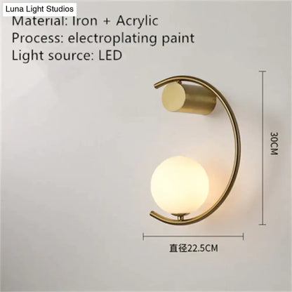 Modern gold luxury creative led bedside wall lamp with curved iron frame and acrylic globe shade for bedroom sconce