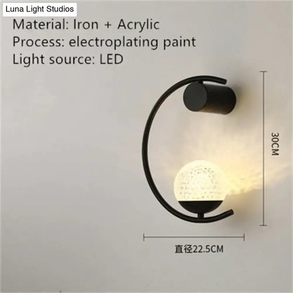 Black iron and acrylic luxury creative led bedside wall sconce with curved arm and textured illuminated globe
