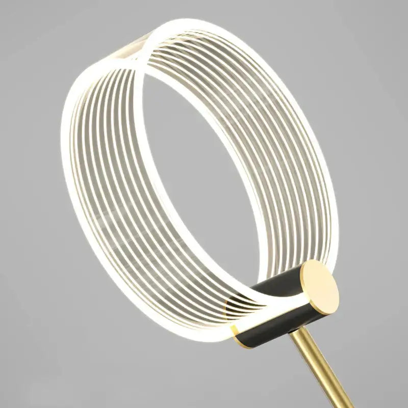 Modern gold luxury led pendant light with sleek circular design, concentric white bands, and polished brass base decorbites gold luxury