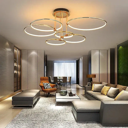 Modern gold luxury ring pendant chandelier with interconnected circular led rings and central hub for dining room decorbites gold luxury