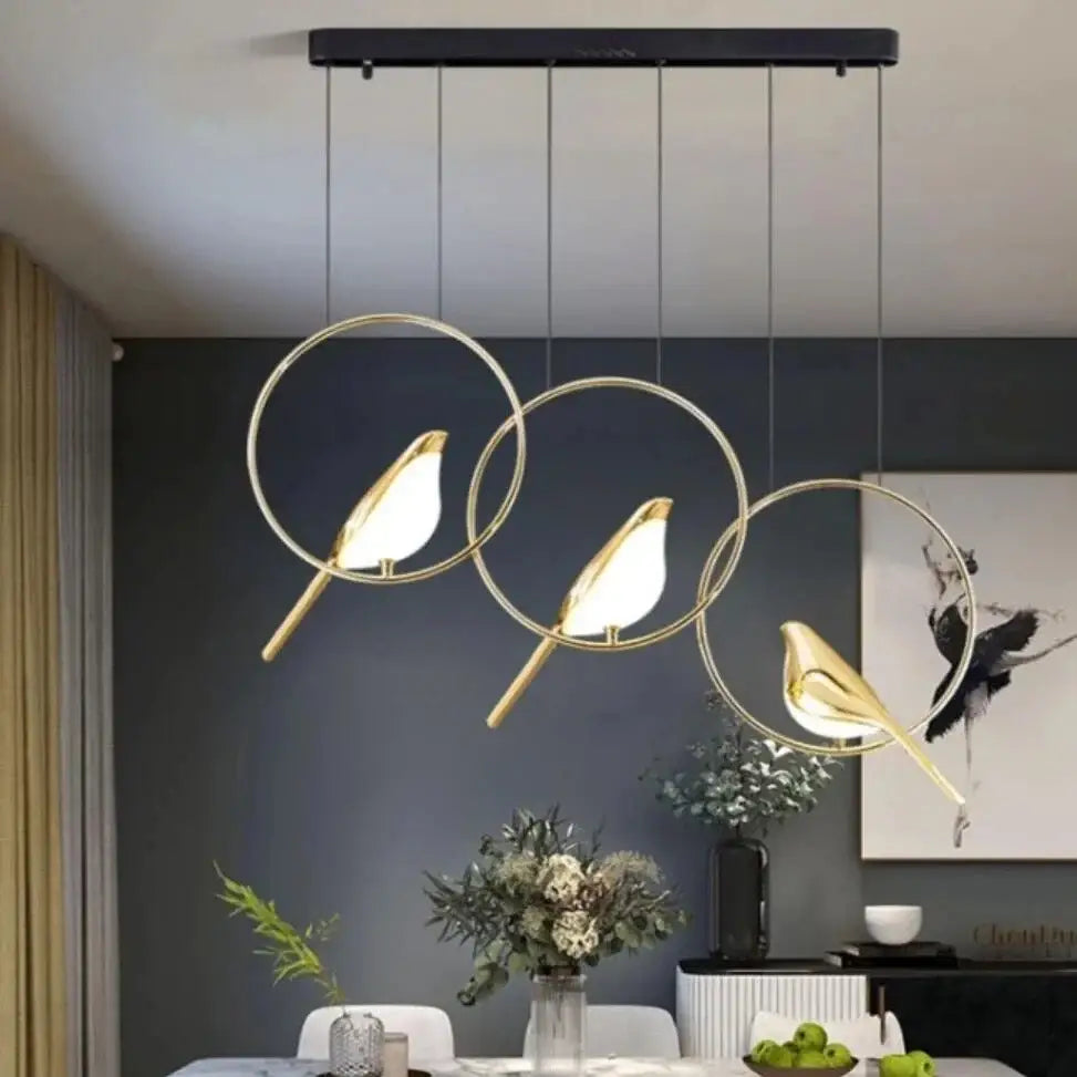 Modern gold magpie bird led chandelier with bird-shaped pendant lights and circular frames for dining room decorbites gold magpie