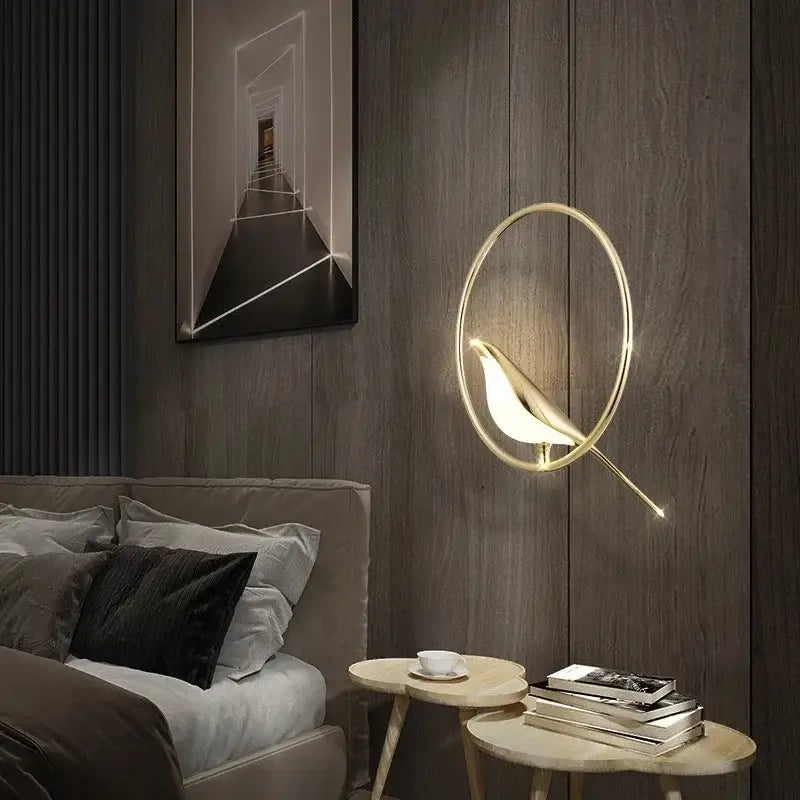 Modern gold magpie bird led chandelier featuring a gold-toned bird-shaped wall sconce with glowing interior light