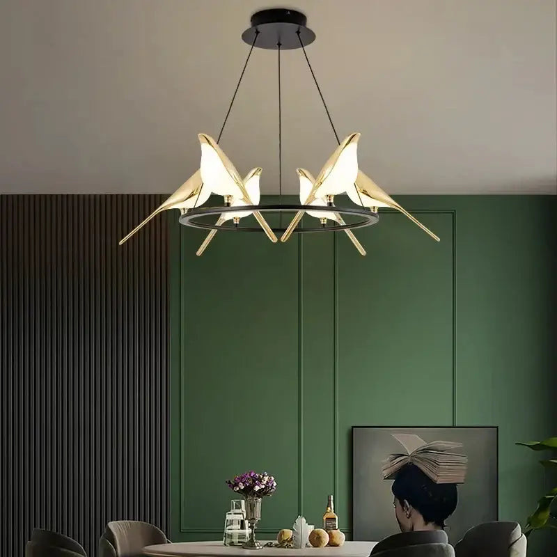 Modern gold magpie bird led ring chandelier featuring a gold-toned bird-shaped pendant light with illuminated wings