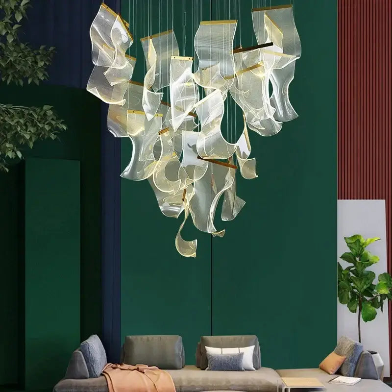 Modern gold mesh duplex building chandelier with translucent flowing glass panels and gold-toned metal accents for living room