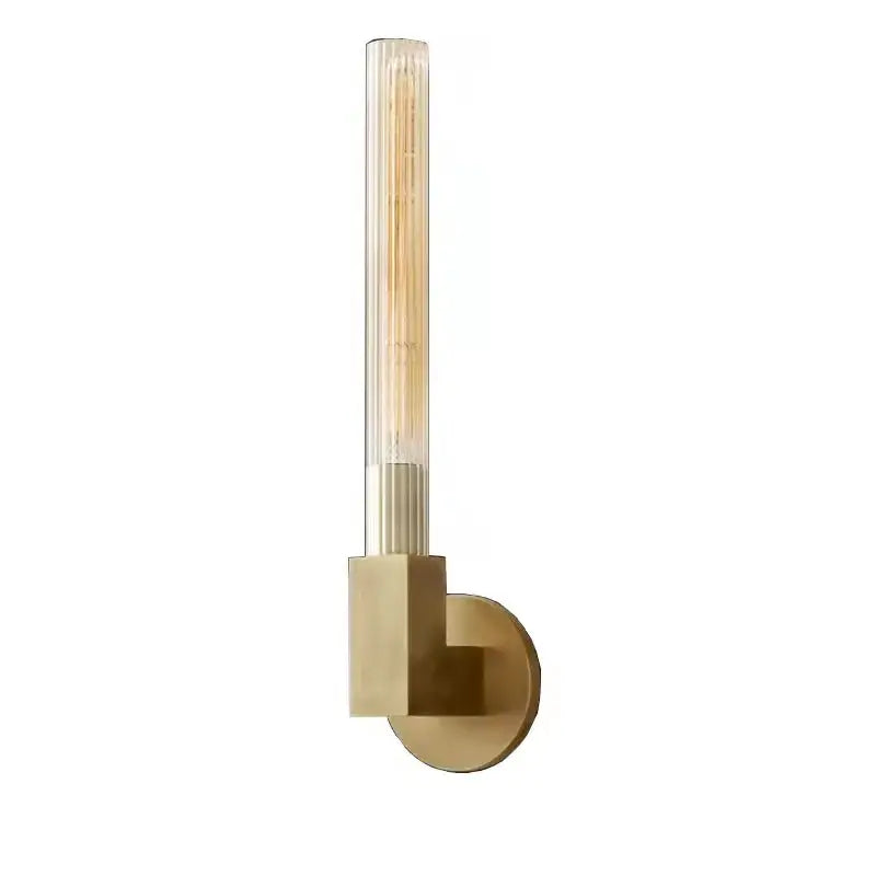 Modern gold metal and glass wall sconce light with a tall clear glass tube housing an exposed filament bulb for bathroom use