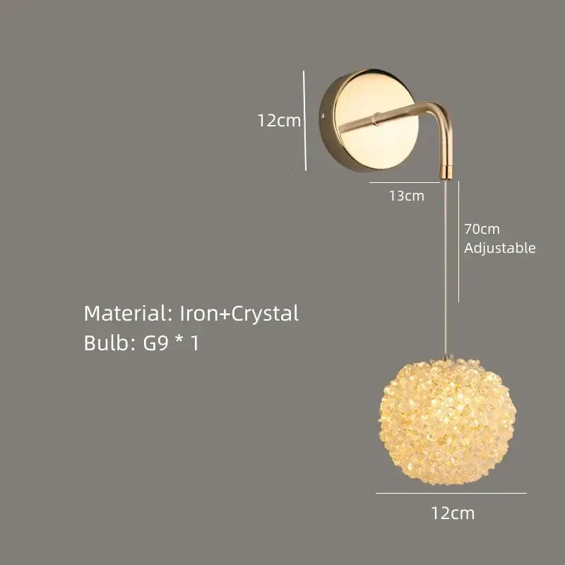 Modern gold metal crystal wall light featuring a spherical crystal pendant with gold metal crystal decorbites bracket