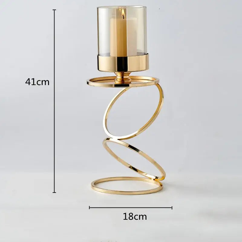 Modern gold metal frame glass candle holder with gold-toned spiral metal and beige pillar candle for dining room decorbites gold metal decor
