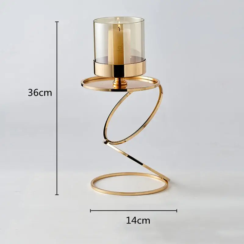 Modern gold metal frame glass candle holder with twisted design and clear glass housing beige pillar candle decorbites gold metal