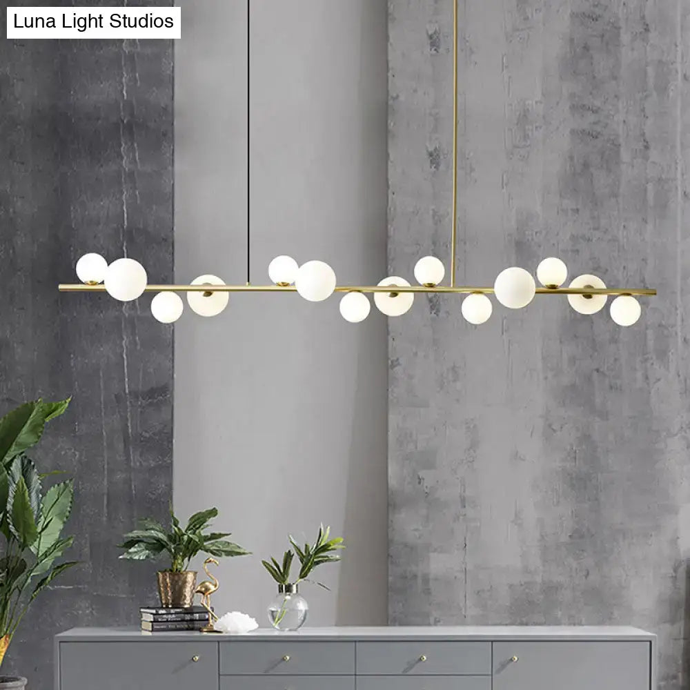 Modern gold metal glass globe chandelier with chain cord length and frosted bulbs for dining table lighting