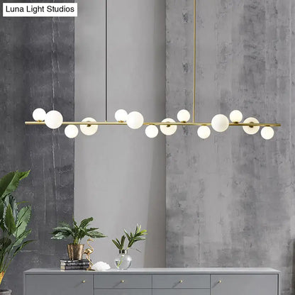Modern gold metal glass globe chandelier with chain cord length and frosted bulbs for dining table lighting