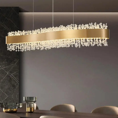 Modern gold metal led chandelier with gold-toned rectangular frame and cascading clear crystal droplets for dining room decorbites gold metal