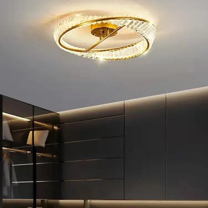 A modern circular ceiling light with decorbites gold metal led frame and crystal rings for living room decor