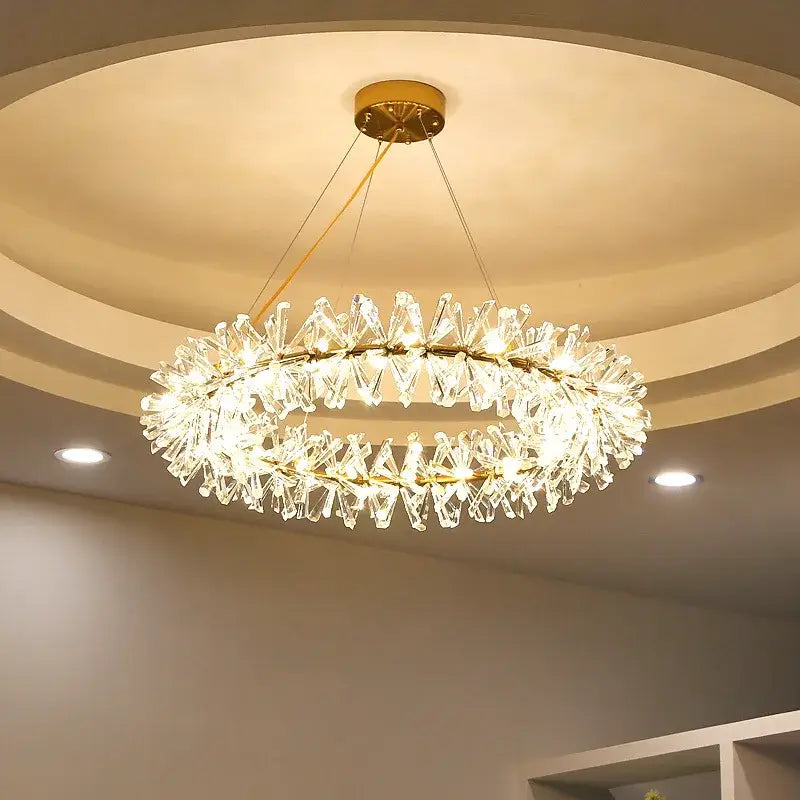 Modern gold metal wire crystal chandelier with double-tiered faceted glass and gold metal accents for dining room lighting