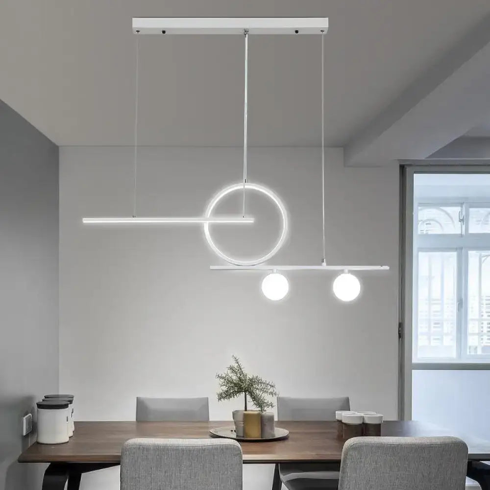 Modern white DecorBites™ pendant light with globe acrylic shade and geometric design for dining room or kitchen lighting