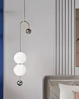 Modern gold minimalist iron chandelier with three spherical glass bulbs suspended by thin metallic chains for dining room decorbites black