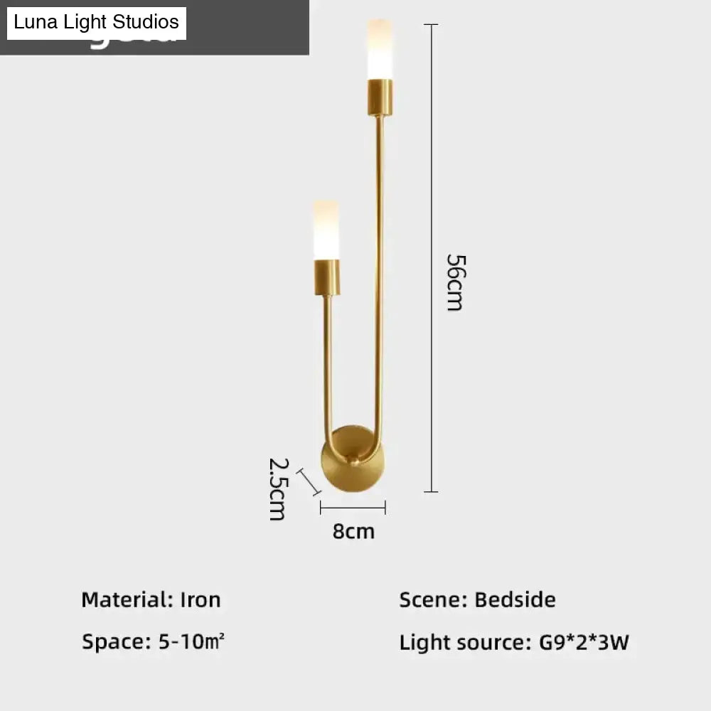 Modern gold minimalist led wall lamp made of iron with two upward-facing cylindrical lights for bedroom use