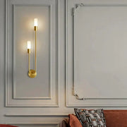 Modern gold minimalist led wall lamp with two vertical candle-style lights and curved design for bedroom wall lamp use