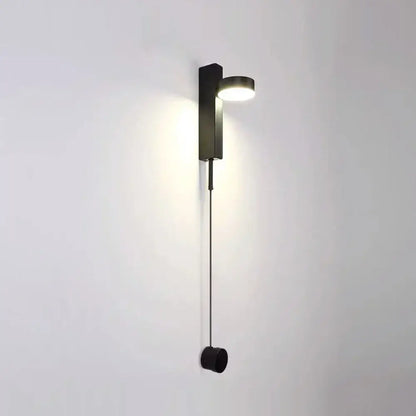 Modern gold minimalist led wall lamp with a black rectangular base and circular light head with pull cord for living room