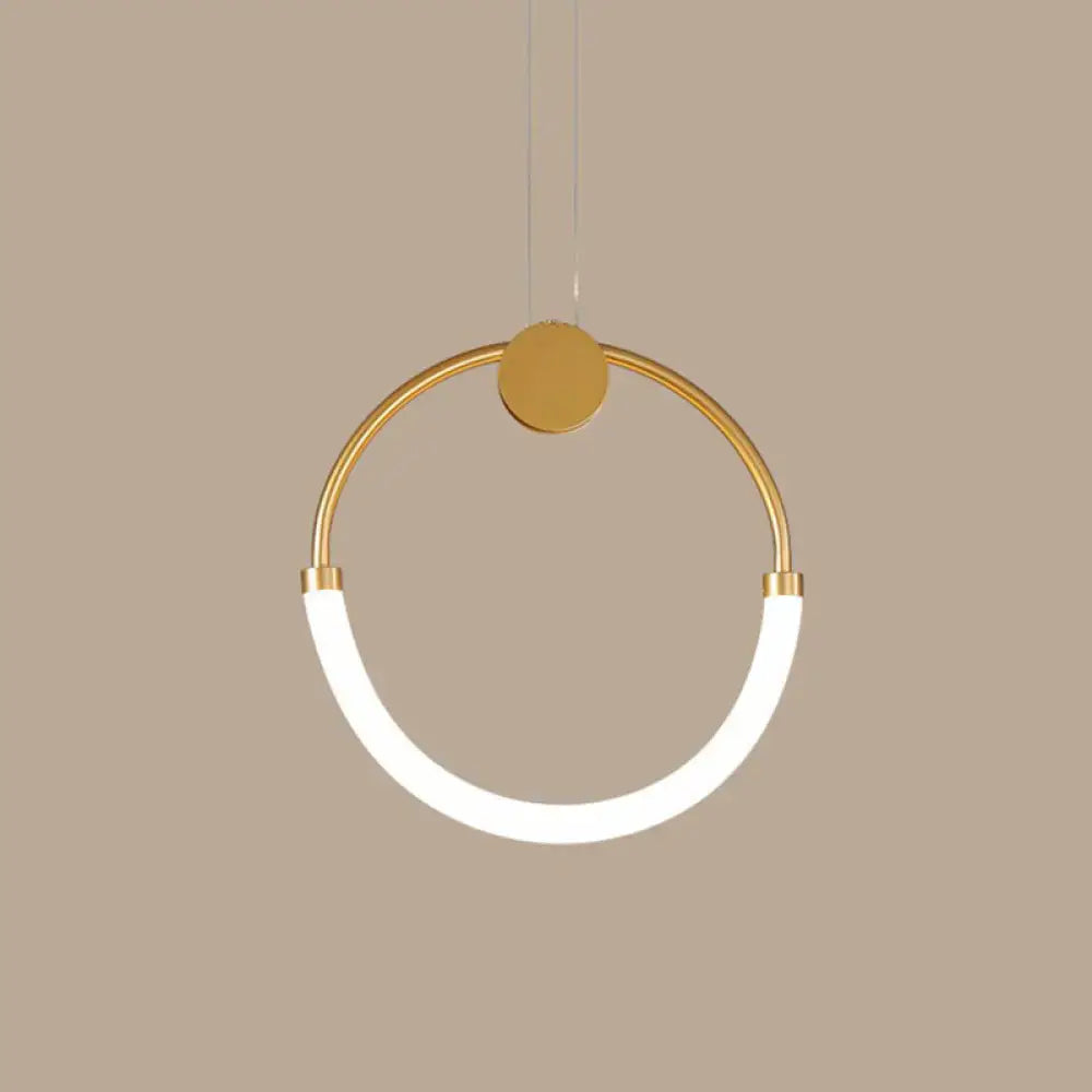 A modern gold minimalistic ring pendant light with a sleek circular frame and white curved led strip for living room