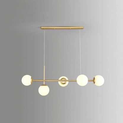Decorbites modo island 5-light pendant light features modern gold-toned metal with milk white frosted glass globes for restaurants