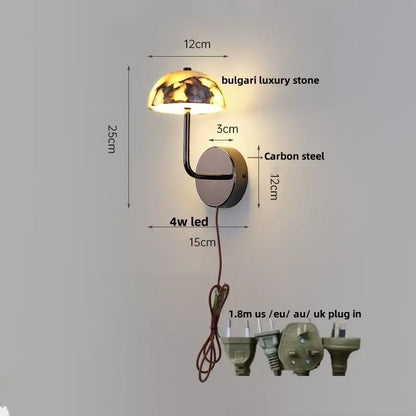 A modern gold mushroom wall lamp with a bulgari luxury stone dome and curved carbon steel arm for bedroom decorbites carbon steel style