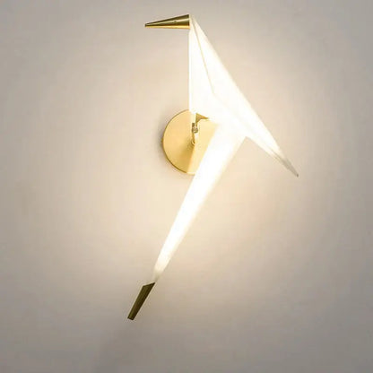 Modern gold origami bird led wall lamp with white translucent paper wings and pointed metallic tips for bedroom use