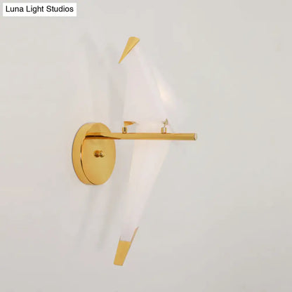 Modern gold origami bird led wall sconce with sleek circular base and angular arms for bedroom lighting fixture