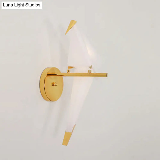 Modern gold origami bird led wall sconce with sleek circular base and angular arms for bedroom lighting fixture