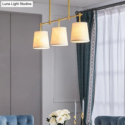 Decorbites modern gold pendant lamp with three off-white fabric shades perfect for dining room lighting