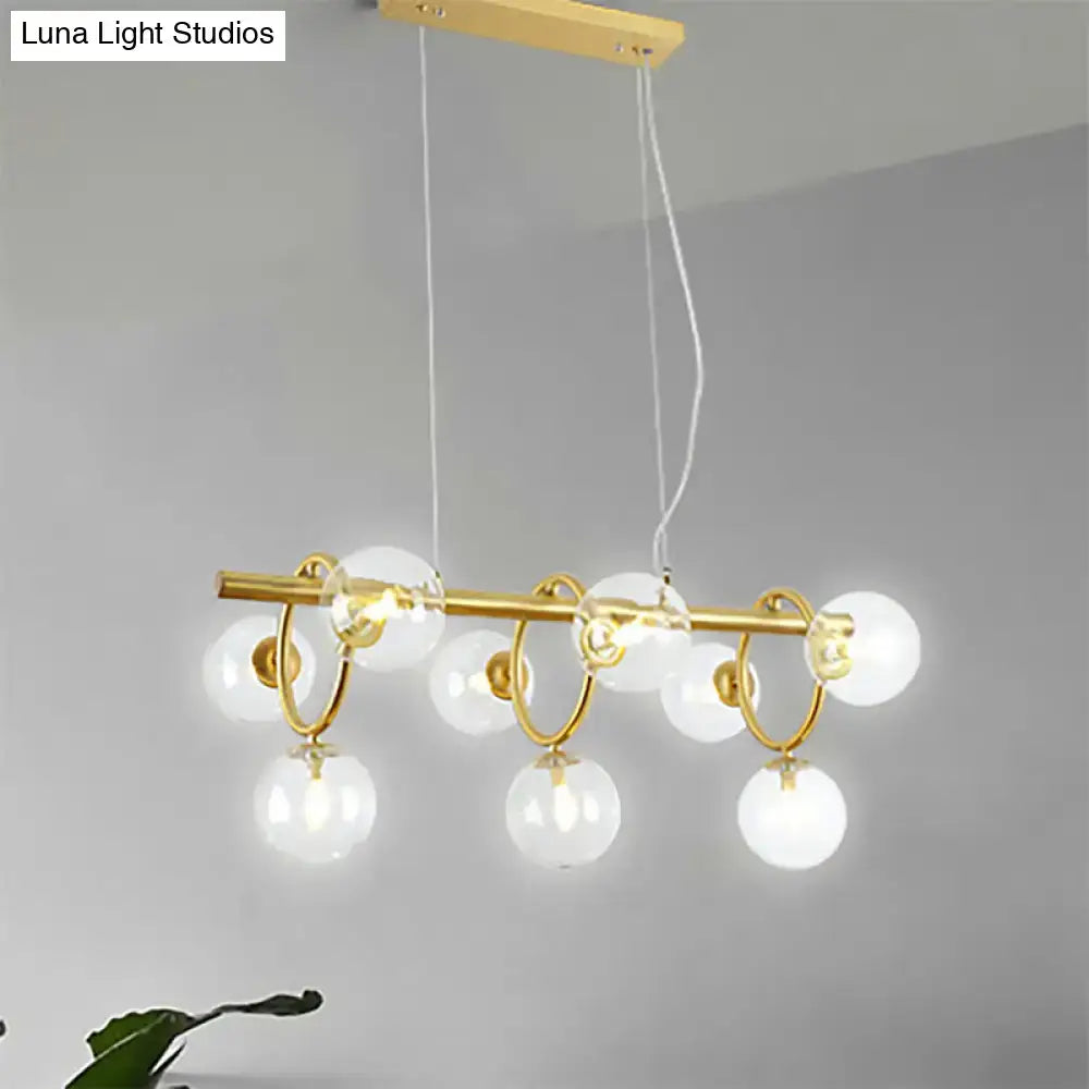 DecorBites™ nordic style gold pendant light with clear cognac glass spherical bulbs and sleek horizontal bar design