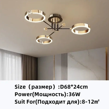 Modern gold plated chandelier with black arms featuring a gold toned circular ceiling light with crystal accents decorbites gold plated