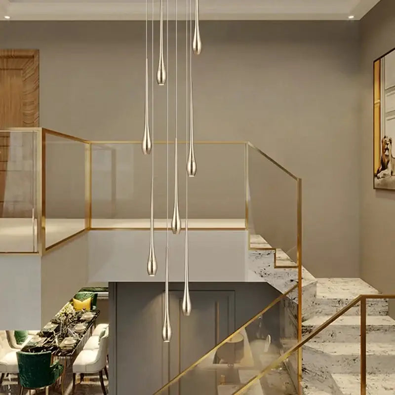 Modern chandeliers featuring elegant silver teardrop pendant lights complement decorbites gold-plated modern designs