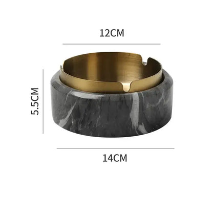 A sleek black and white marble texture ashtray with a polished gold plated inner rim by decorbites for living room use