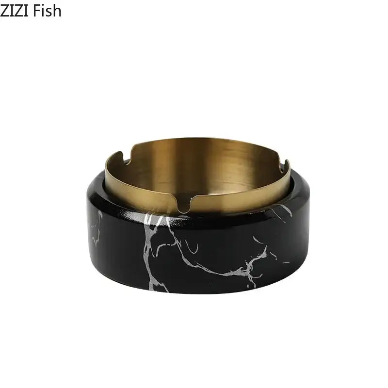 Black marble texture ashtray with a gold plated interior and cut-out slots by decorbites for modern living room use
