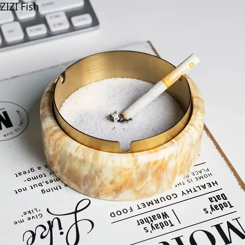 Modern gold plated ashtray with marble texture beige cream body and metallic rim for living room smoking decorbites gold plated