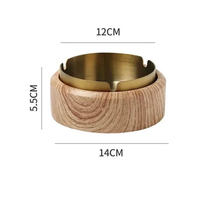 A gold plated brass ashtray with marble texture wood grain base and four notched edges for smoking decorbites gold plated