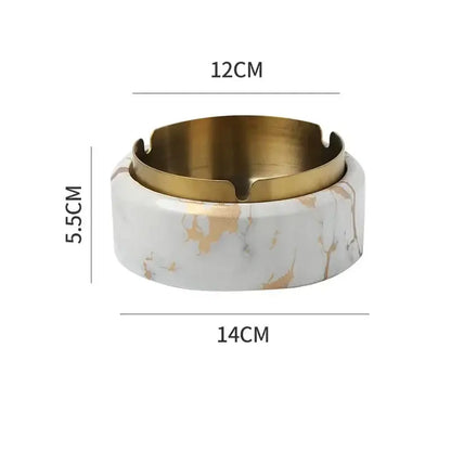 A modern gold plated ashtray with white marble texture base and polished brass rim for living room decorbites