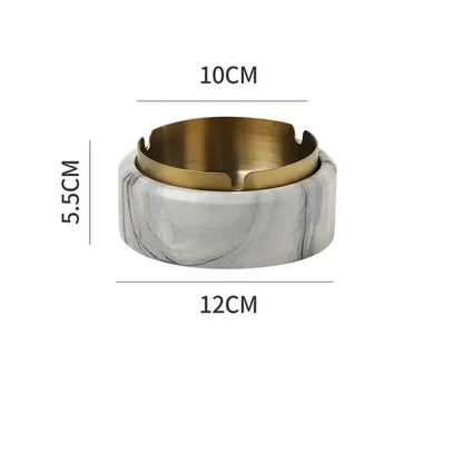 Modern gold plated marble texture ashtray with a marble effect and gold toned metal rim for living room decor by decorbites